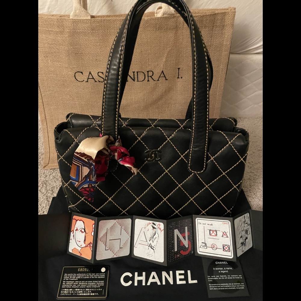 CHANEL Black Quilted Tote with Red Accents